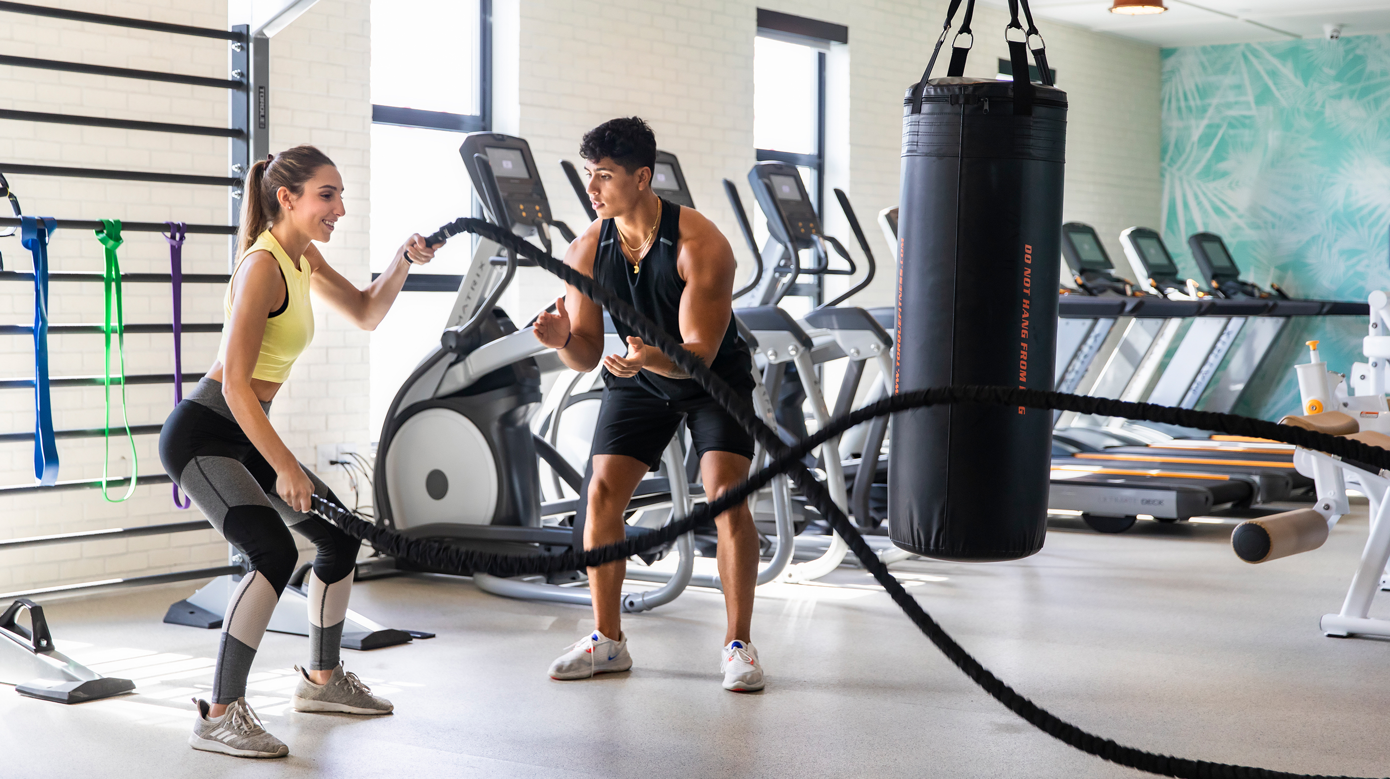 Friends exercising in a gym